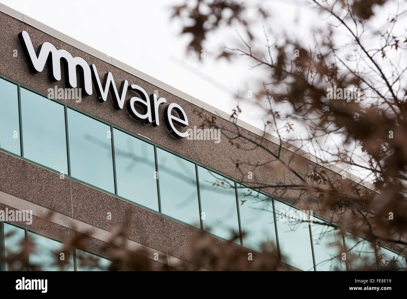 A logo sign outside of an office building occupied by VMware, Inc., in Reston, Virginia on January 1, 2016. Stock Photo