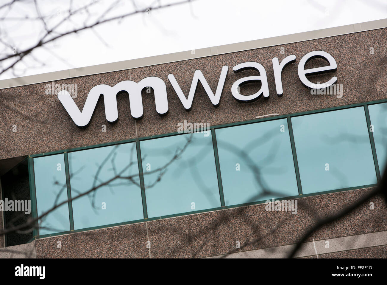 A logo sign outside of an office building occupied by VMware, Inc., in Reston, Virginia on January 1, 2016. Stock Photo