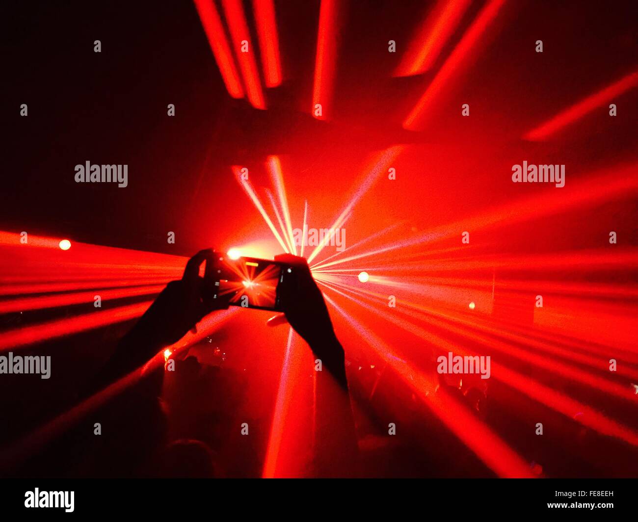 Person Taking Picture At Night Club Party Stock Photo