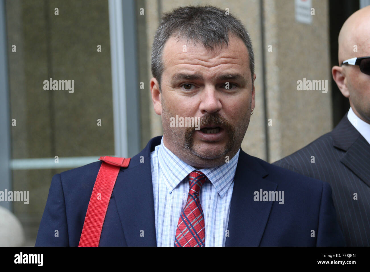 Sydney, Australia. 5 February 2016. Nick Folkes, Chairman of the Party for Freedom and Shermon Burgess, known as The Great Aussie Patriot left the Federal Court Australia after attending a directions hearing. They were jubilant that Sutherland Shire Council and Jamal Rifi had discontinued their legal action against them. Supporters including Ralph Cerminara attended the hearing. Left wing activist Shayne Hunter attended the hearing and afterwards went for a drink with the pariots. Pictured: Nick Folkes (handlebar moustache). Credit:  Richard Milnes/Alamy Live News Stock Photo