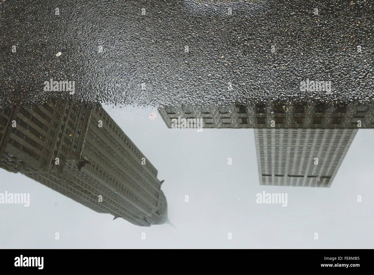 Reflection Of Buildings In Puddle Stock Photo - Alamy