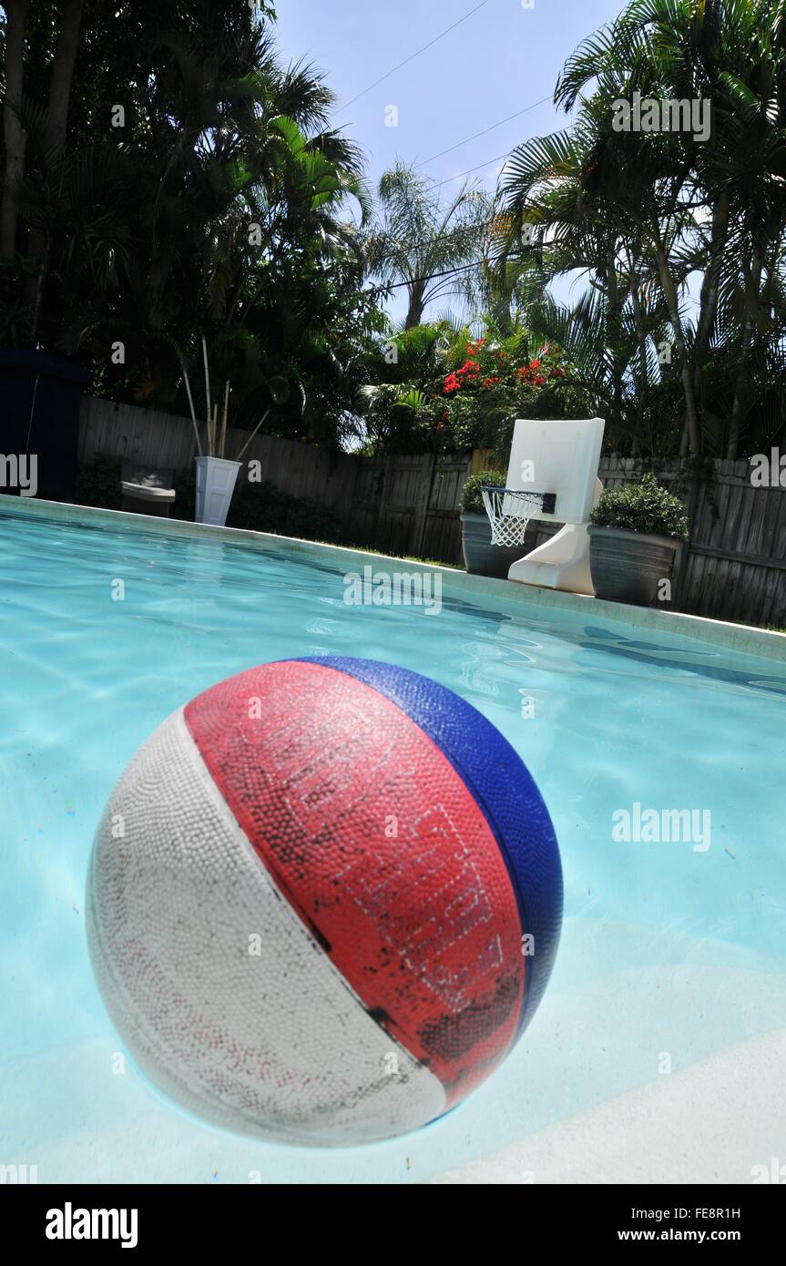 Basketball In Swimming Pool Stock Photo Alamy