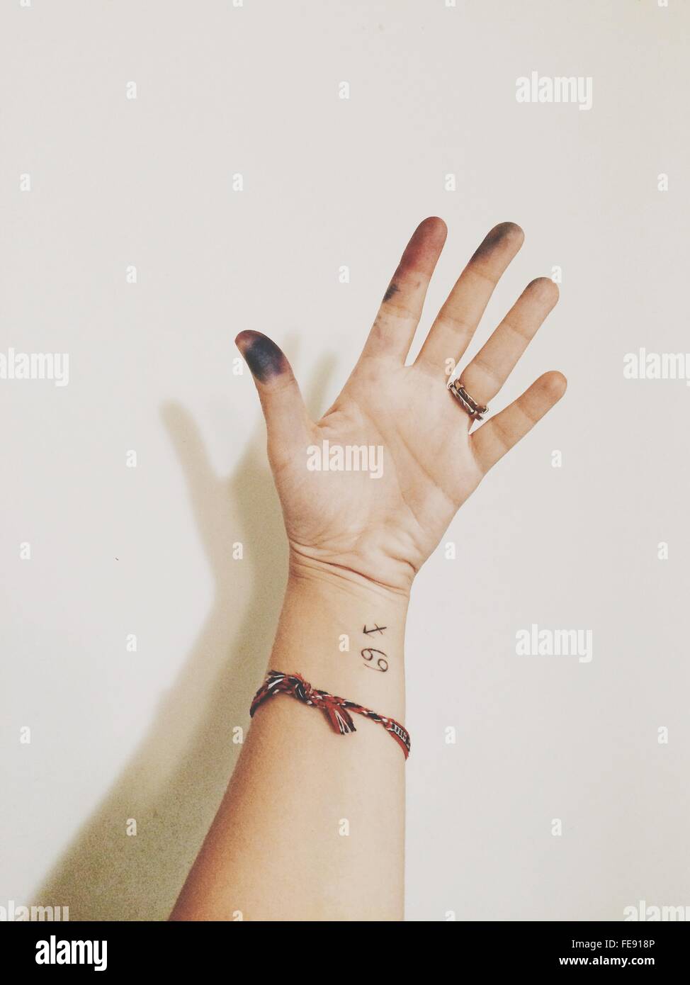 Hand Of Woman, With Tattoo And Dirty Fingers Stock Photo