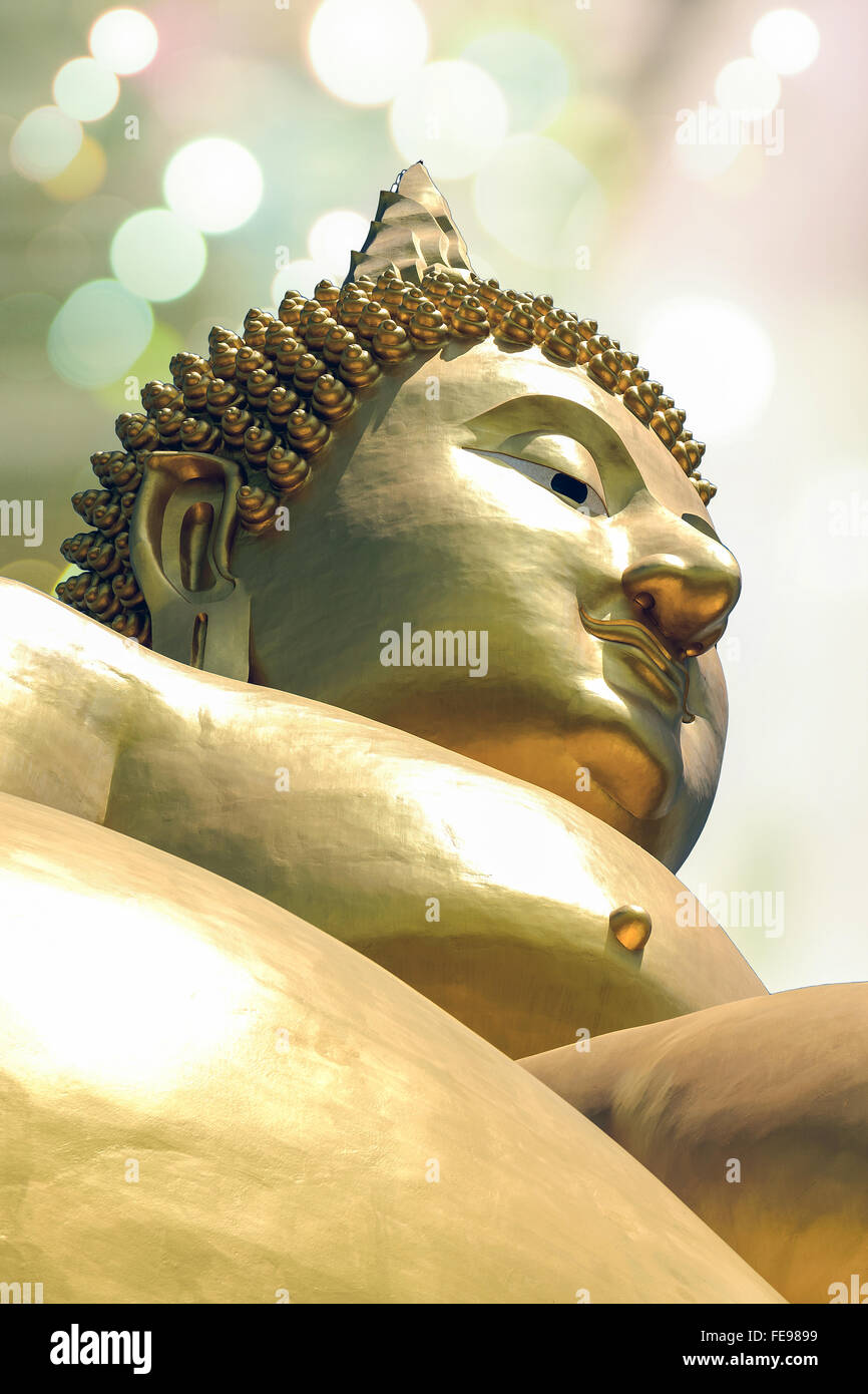 Golden Buddha statue isolated on colorful background Stock Photo - Alamy