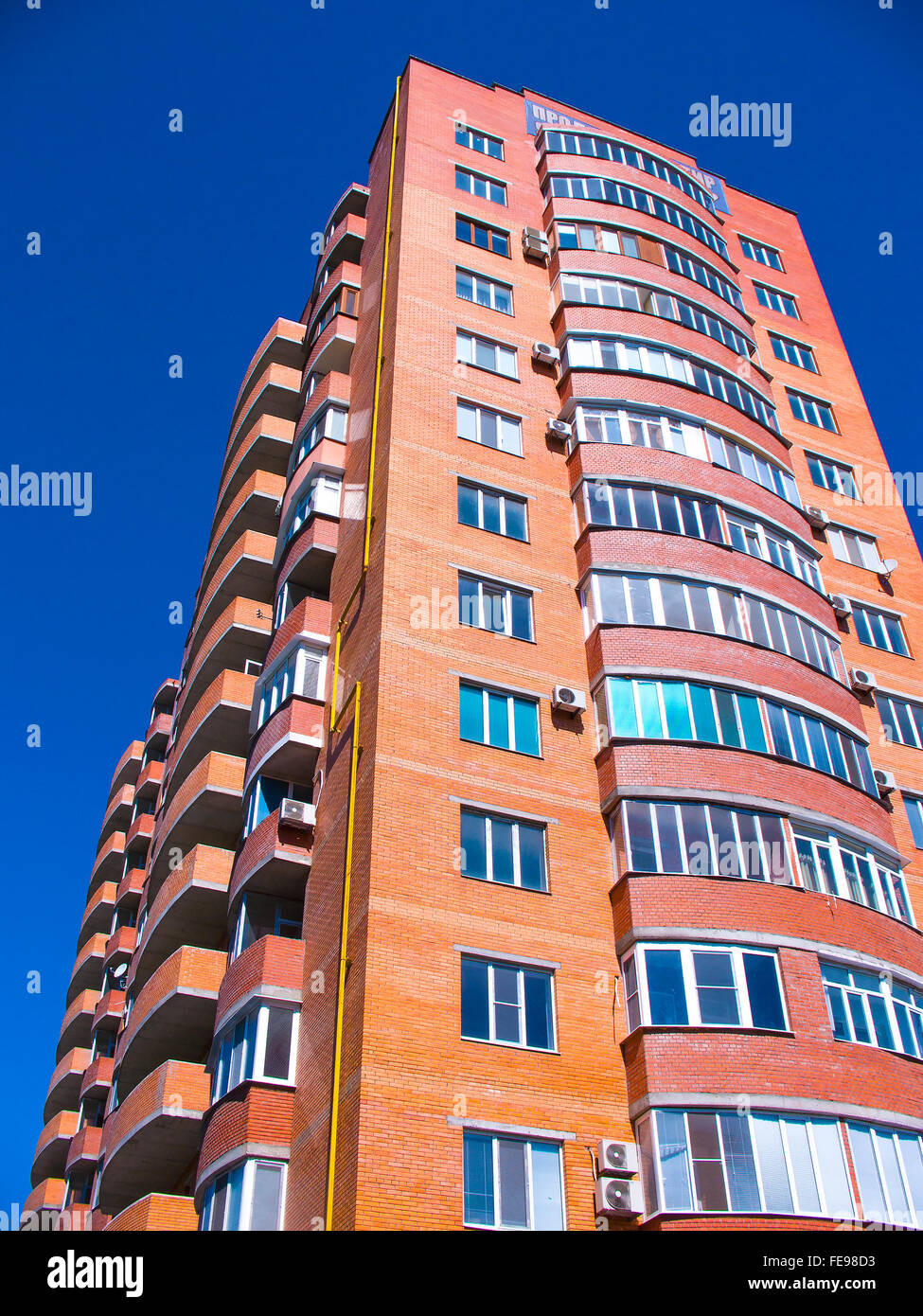 high residential house on blue sky background Stock Photo - Alamy