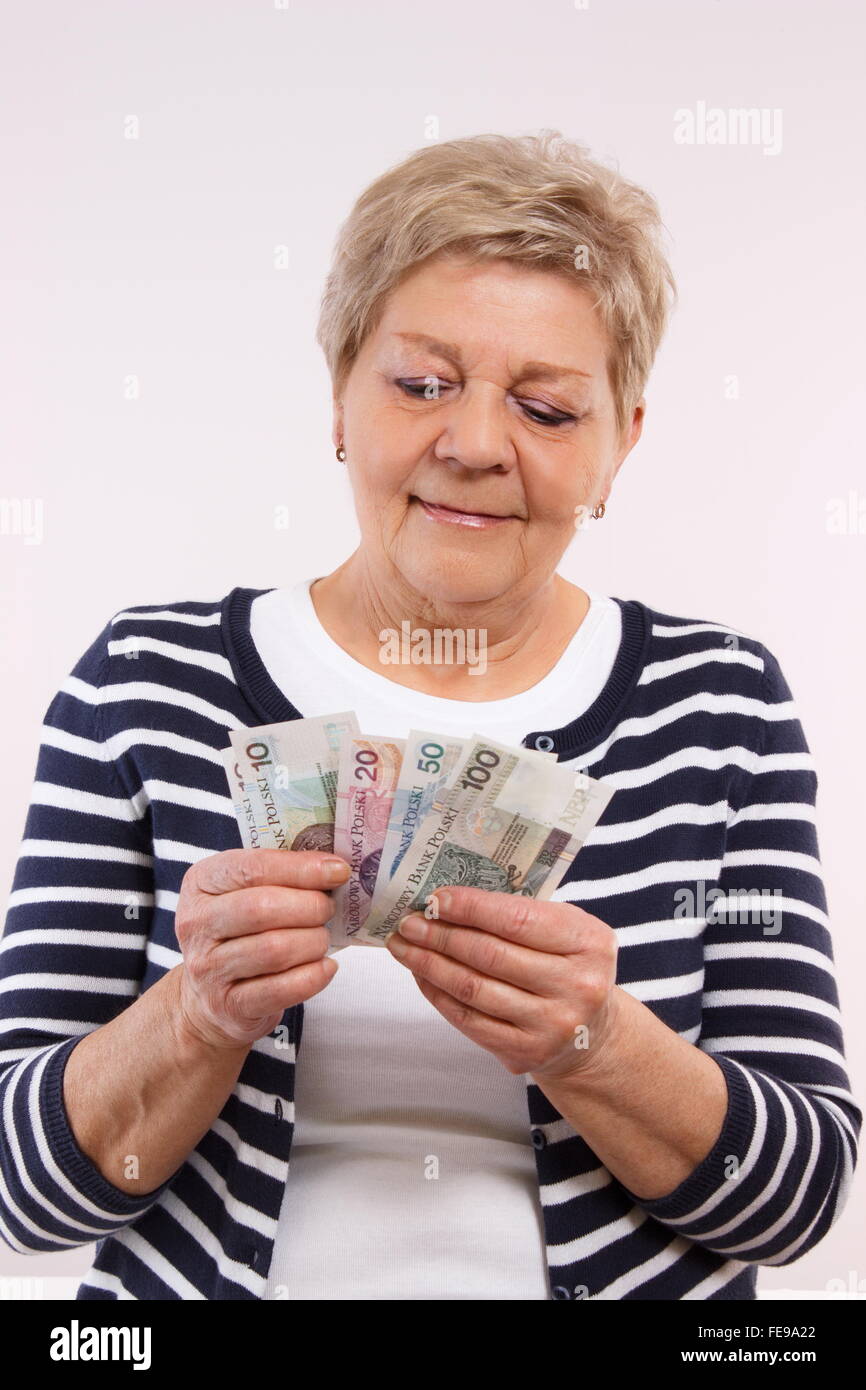 Elderly lady counting money hi-res stock photography and images - Alamy