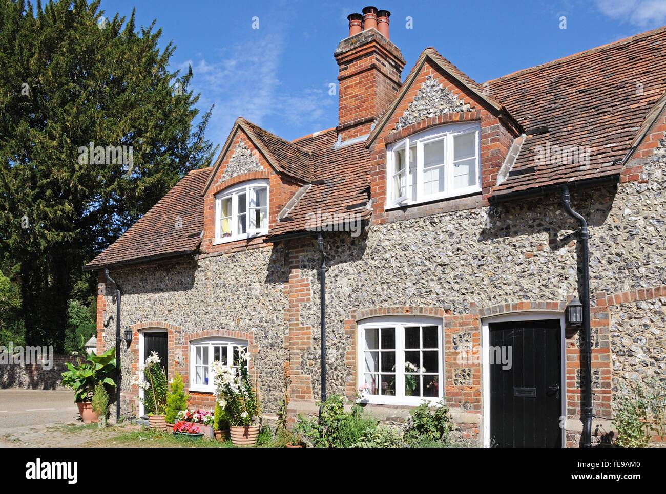 Pretty Brick And Flint Cottages With Dormer Windows Along A