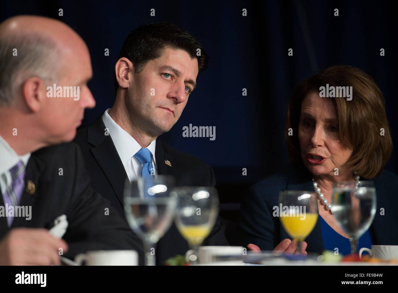 Washington, DC, USA. 04th Feb, 2016. US Speaker of the House Paul Ryan (Republican of Wisconsin), center, talks with former US Speaker of the House Nancy Pelosi (Democrat of California), right, prior to the National Prayer Breakfast in Washington, DC, USA, 04 February 2016. For 63 years the National Prayer Breakfast has given presidents the opportunity to gather with members of Congress and evangelical Christians to pray and talk about the role of prayer in their own lives. Credit: Shawn Thew/Pool via CNP /dpa - NO WIRE SERVICE - Credit:  dpa/Alamy Live News Stock Photo