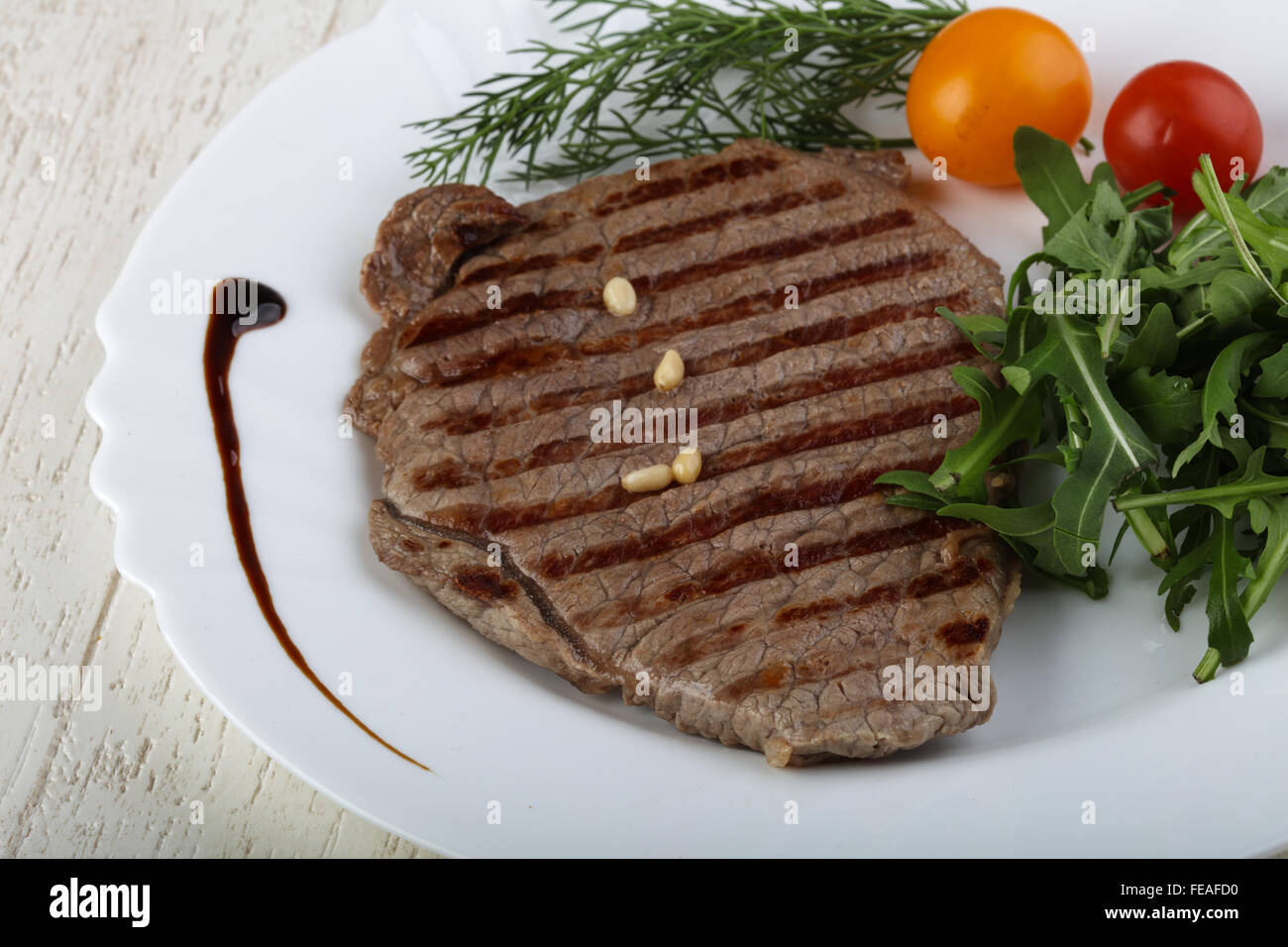 Grilled beaf steak with rucola and dill leaves Stock Photo Alamy