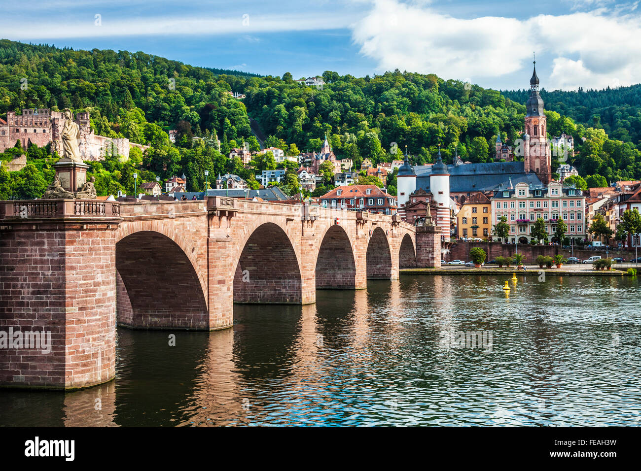 The Alte Brucke, old bridge or Karl Theodor Bridge and Heiliggeistkirche in Heidelberg. Stock Photo