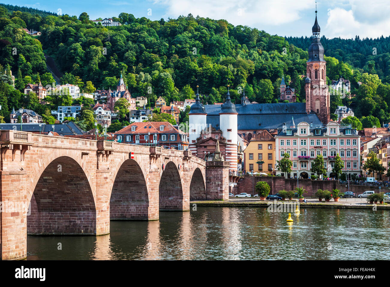 The Alte Brucke, old bridge or Karl Theodor Bridge and Heiliggeistkirche spire in Heidelberg. Stock Photo
