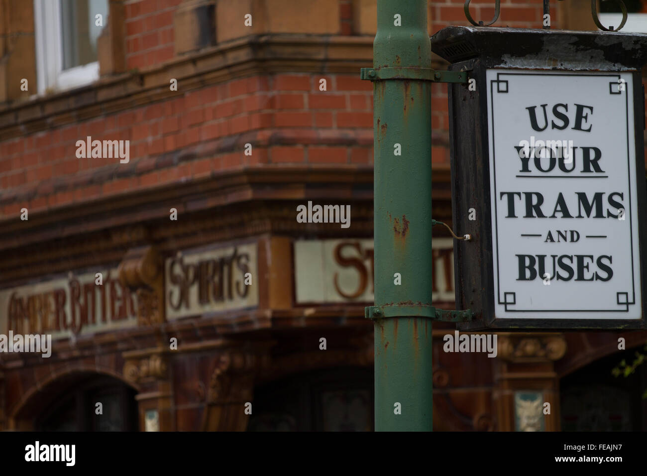 A vintage sign on display at Crich Tramway Village encouraging people to Use Your Trams and Buses (to stop the rise of the car) Stock Photo