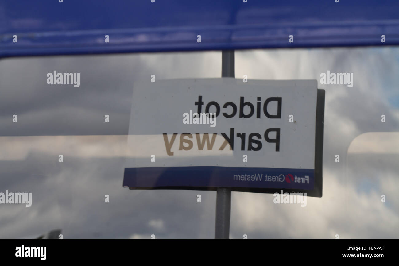Didcot Parkway (First Great Western - Now Great Western Railway GWR)) station sign reflected in the window of an HST (High Speed Train). Stock Photo