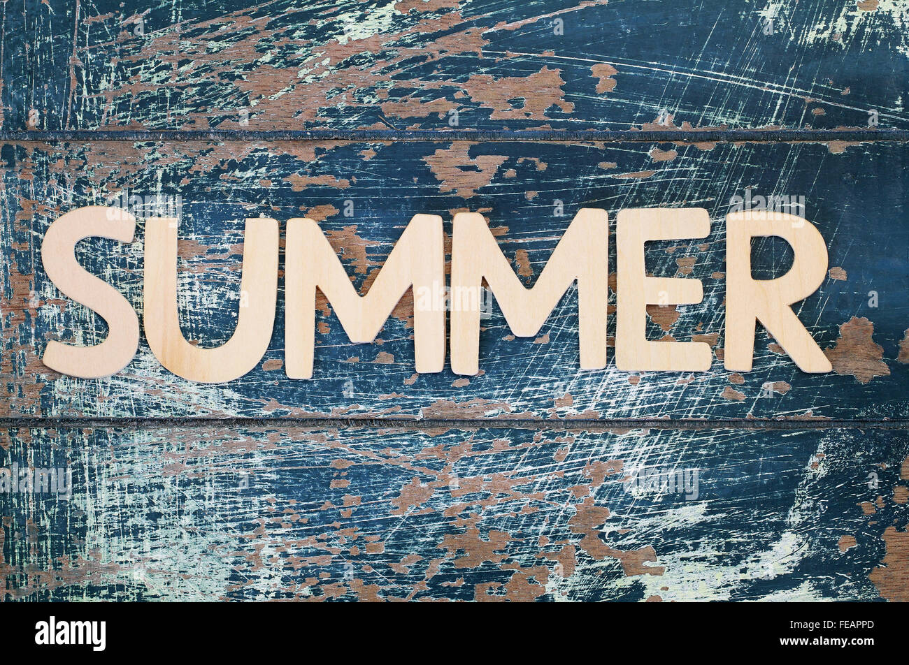 Word summer written with wooden letters on rustic surface Stock Photo