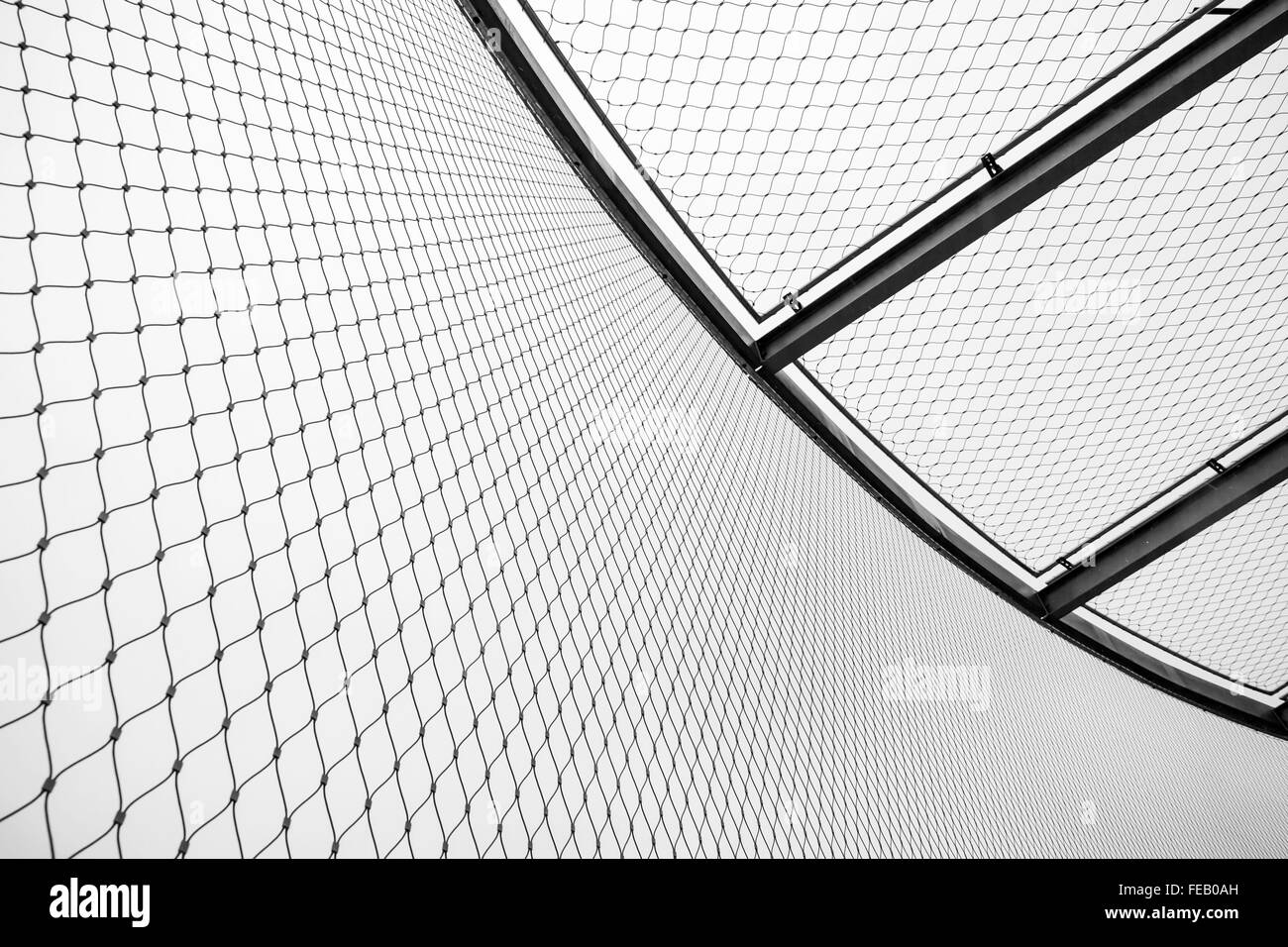 Round steel chain link fence and ceiling, restricted area border Stock Photo