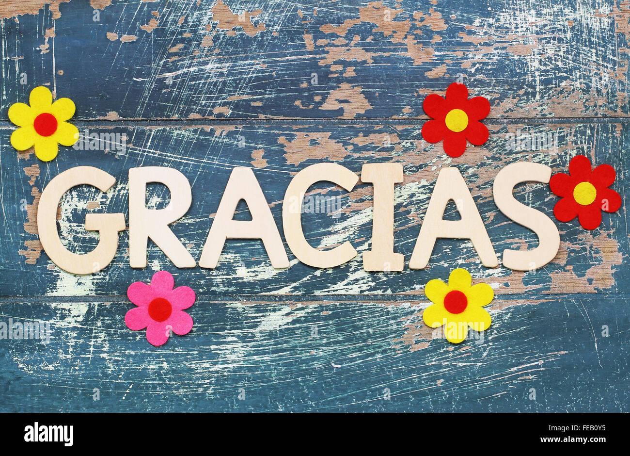 Gracias Thank You In Spanish Written With Wooden Letters On Rustic Surface And Colorful Flowers Stock Photo Alamy