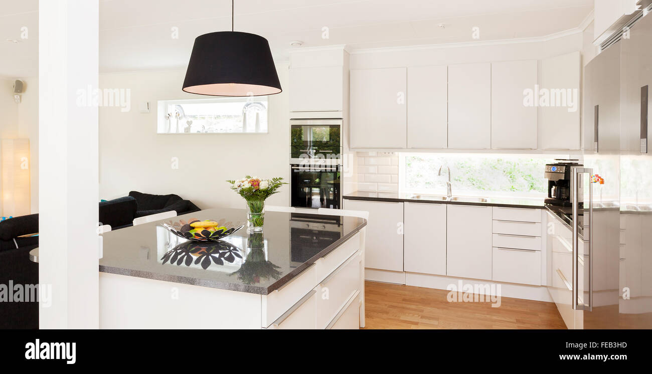 https://c8.alamy.com/comp/FEB3HD/fancy-kitchen-interior-with-kitchen-island-of-granite-FEB3HD.jpg