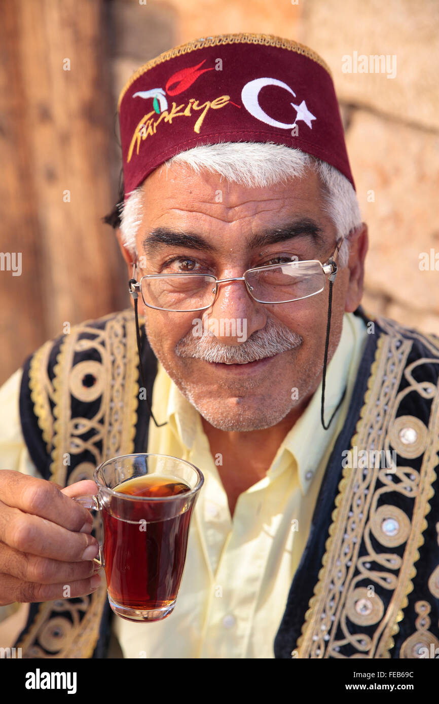 Turkish man drinking Turkish Tea in Fez, Kaleici, Antalya, Turkey Stock Photo