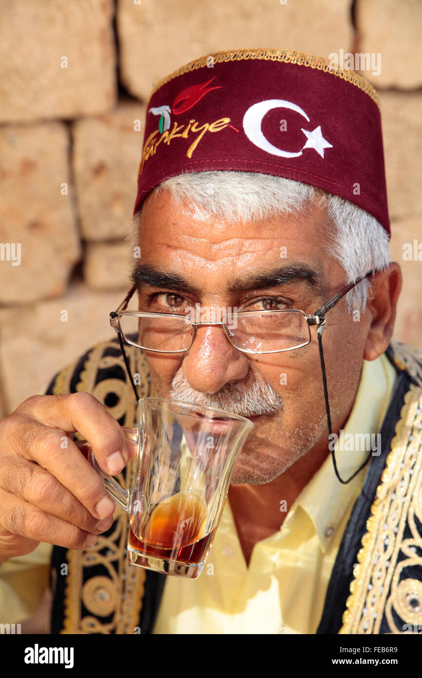 Turkish man drinking Turkish Tea in Fez, Kaleici, Antalya, Turkey Stock Photo