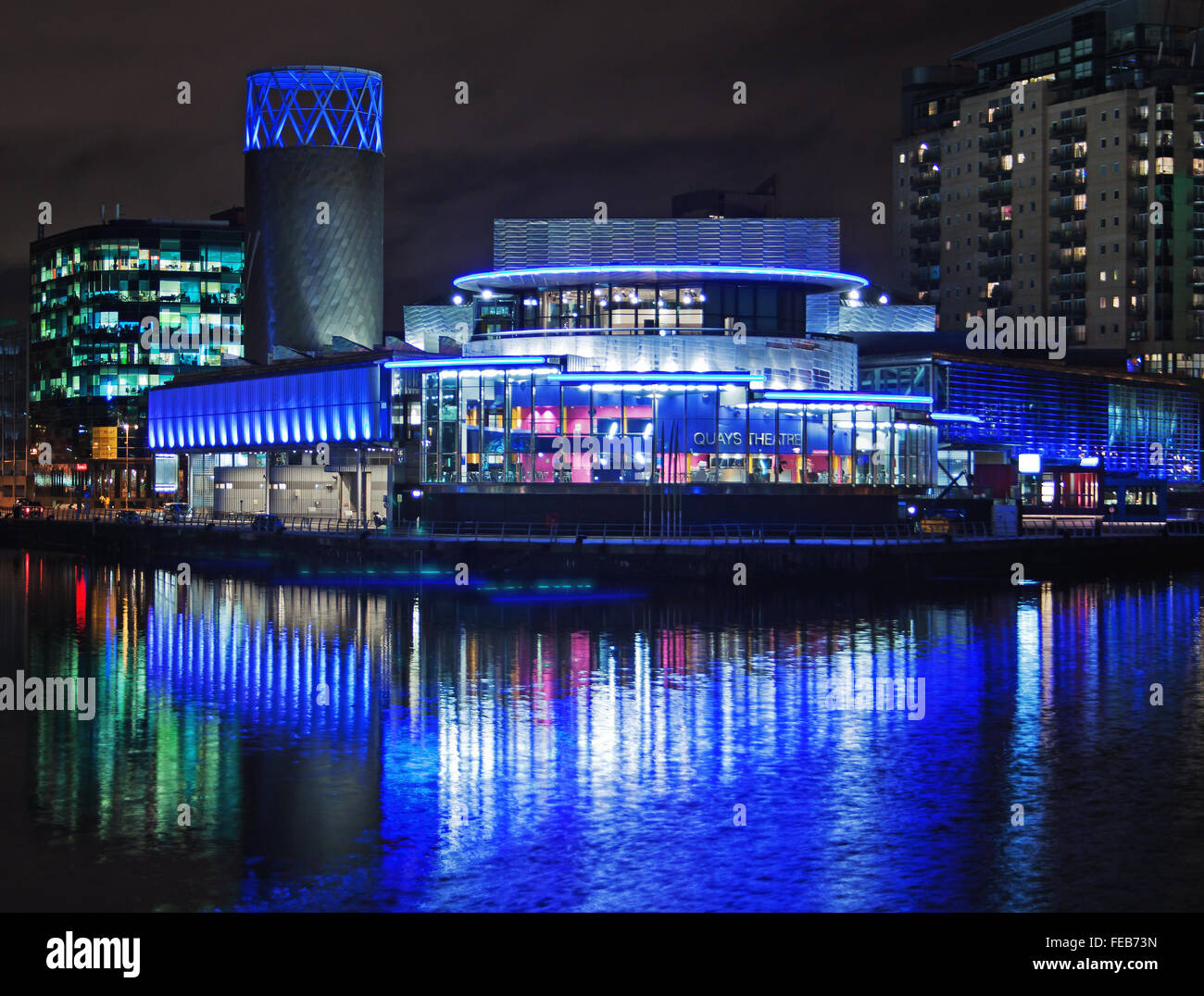Lowry at night. The Lowry Theatre and Gallery at Salford Quays, viewed across the waterway Stock Photo