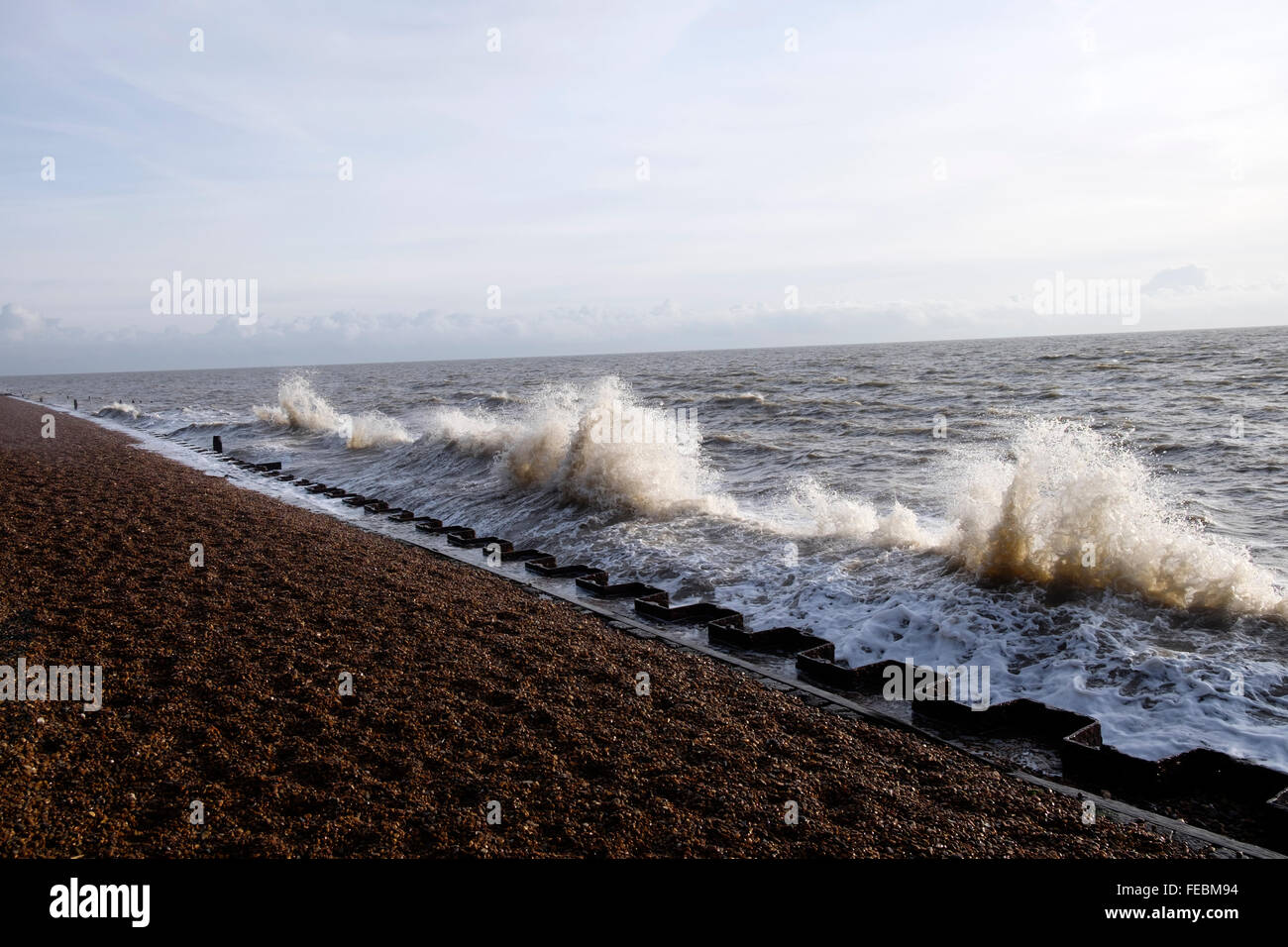 Waves which have bounced off a seawall crashing onto incoming waves, Bawdsey Ferry, Suffolk, UK. Stock Photo