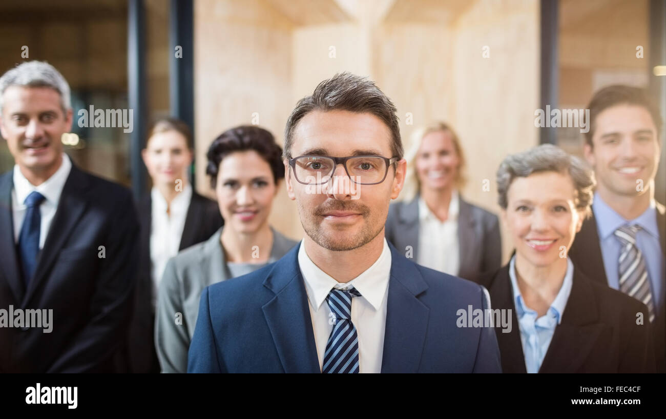Business team smiling at the camera Stock Photo - Alamy