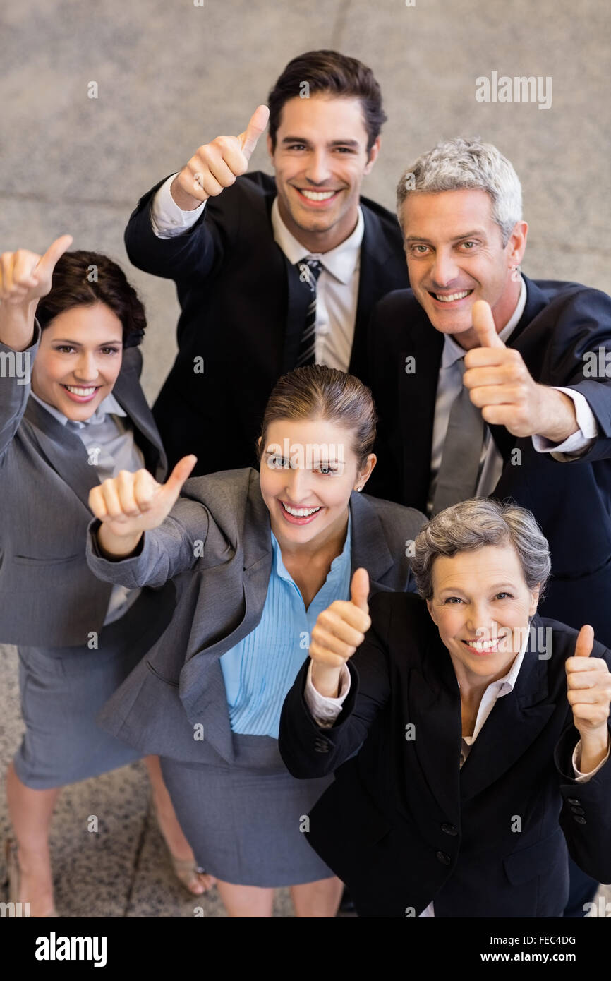 Business team showing thumbs up Stock Photo - Alamy