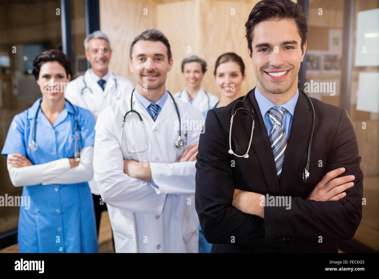Medical team smiling at camera together Stock Photo - Alamy