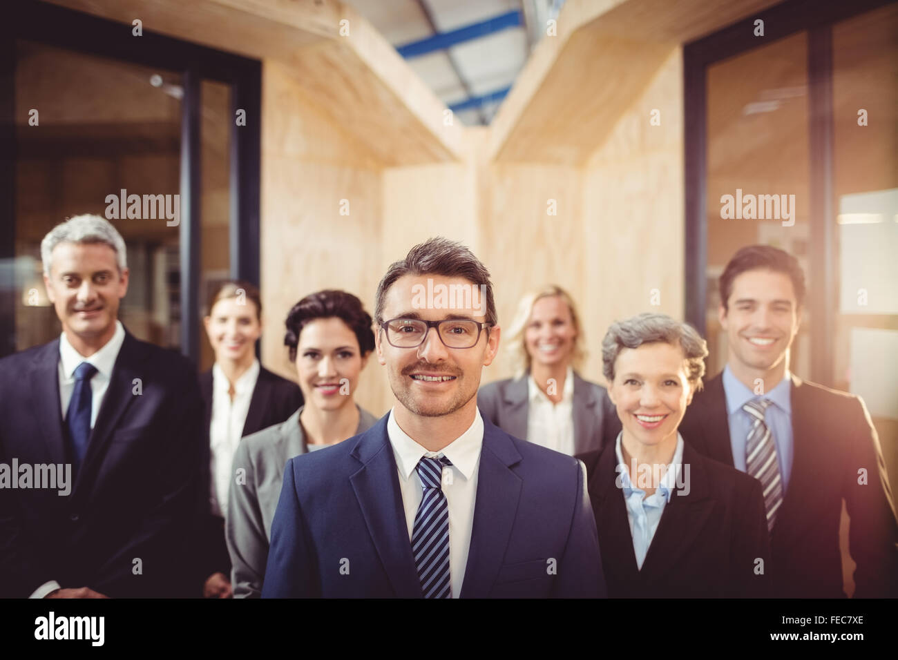 Business team smiling at the camera Stock Photo - Alamy