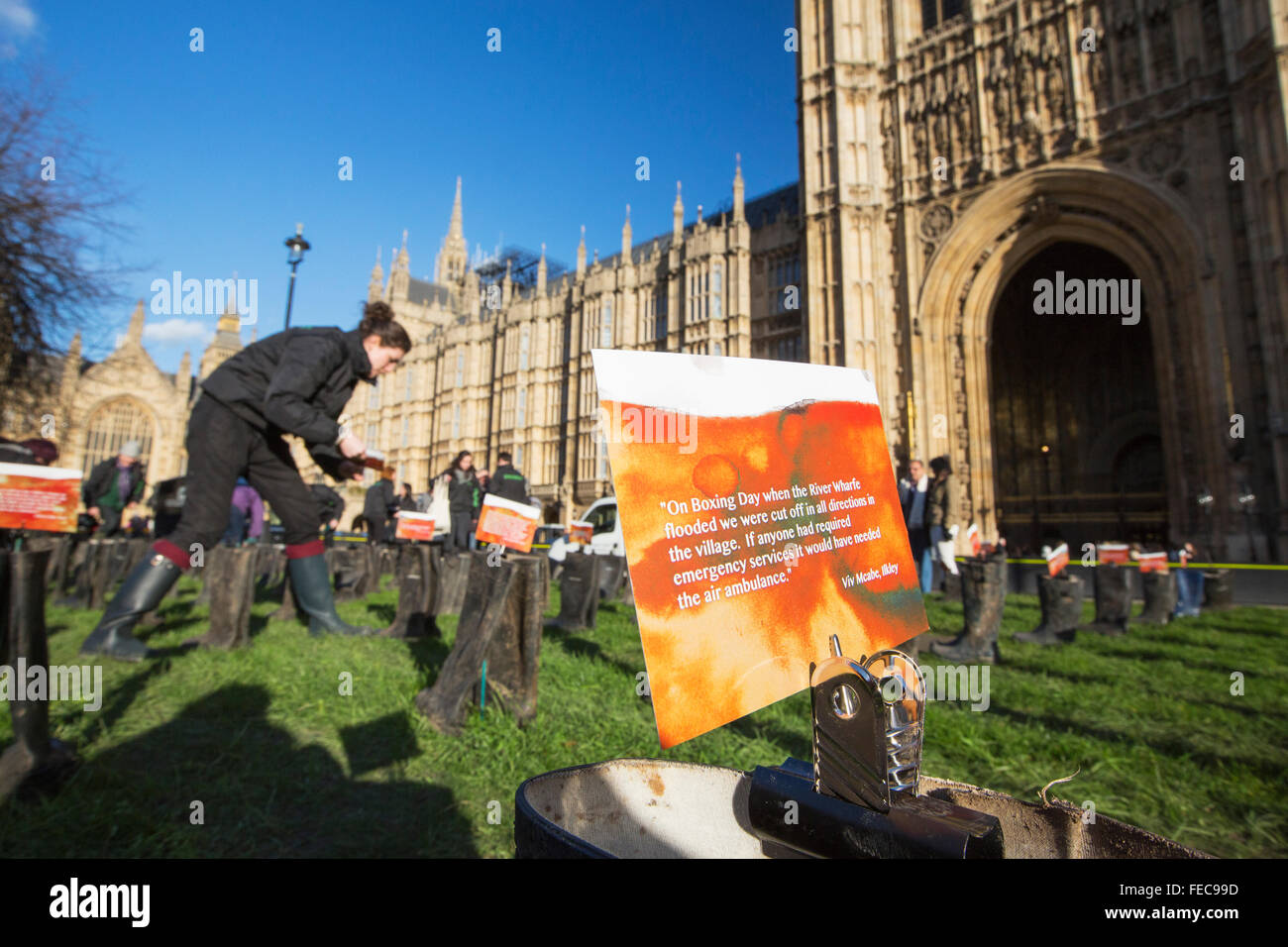 On Thursday 28th January 2016 Greenpeace UK handed in a petition to Downing Street protesting about the recent catastrophic flooding. As part of the day, an art instalation of Wellington Boots were place outside the Houses of Parliament. On each pair of boots a message was attached from someone who had been affected by the floods. Stock Photo