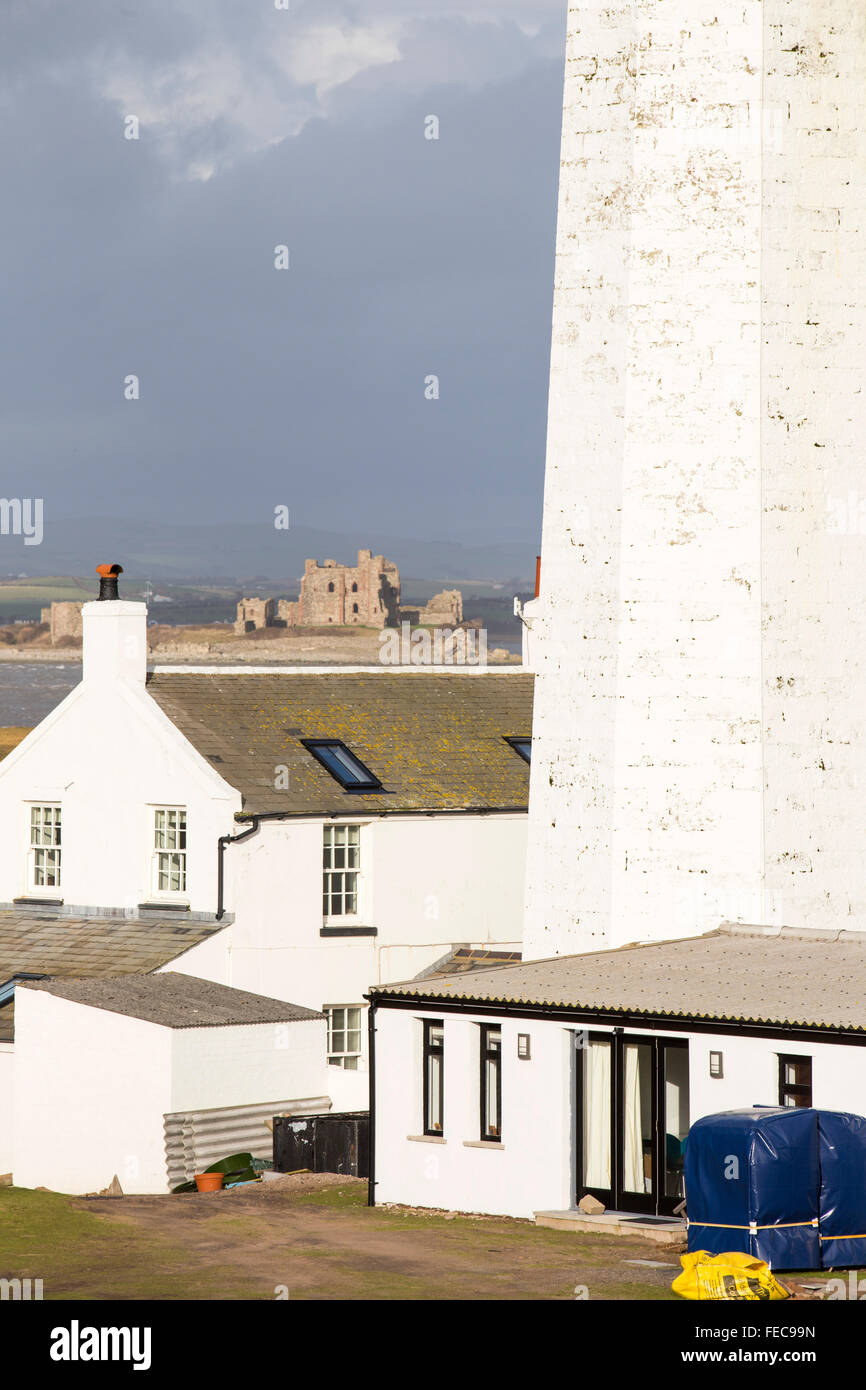 The lighthouse on the southern tip of Walney Island, Cumbria, UK, looking towards Piel Castle on Piel Island in the background. Stock Photo