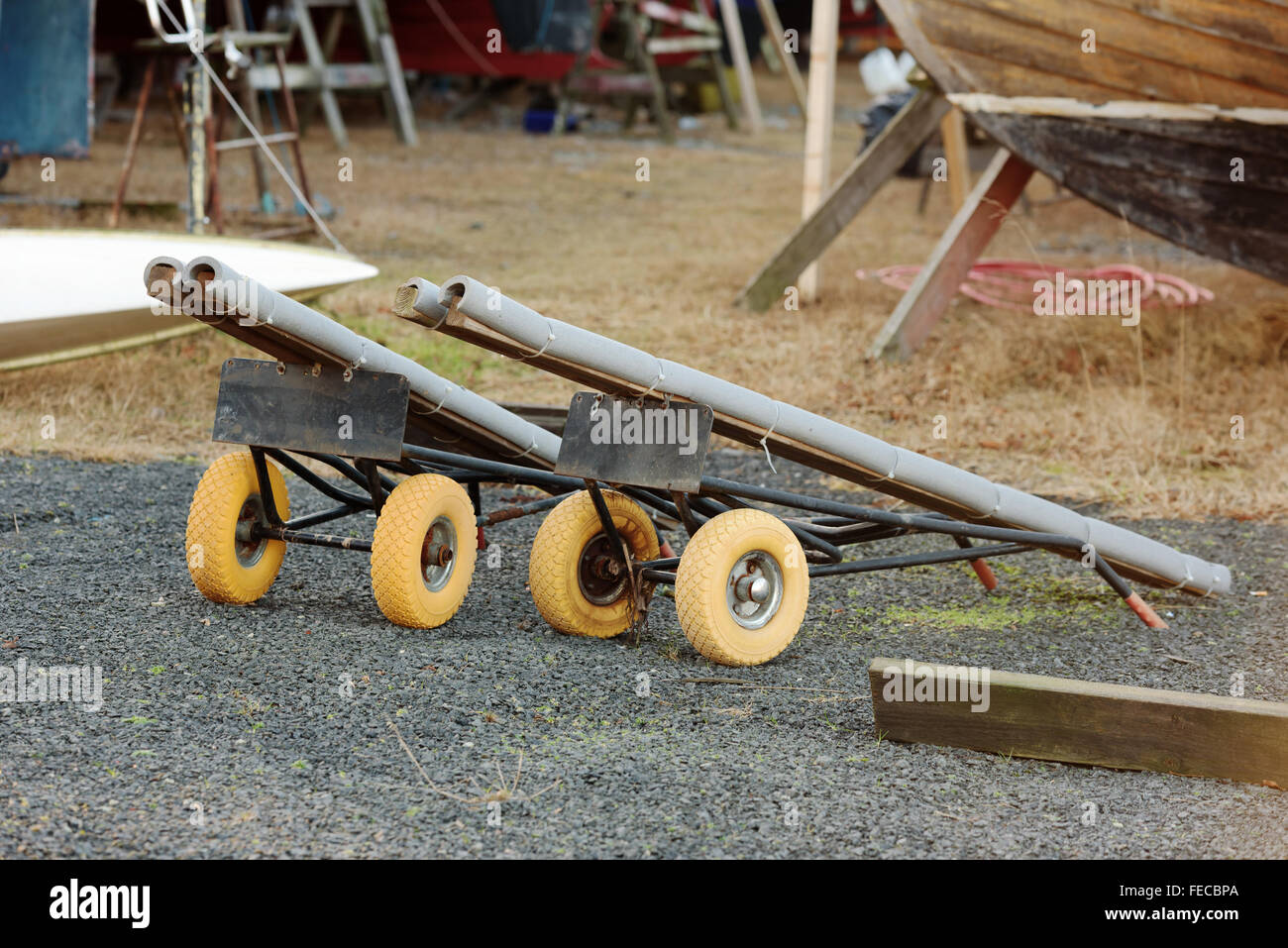 Two DIY boat transporters or carts parked in a marina. Stock Photo