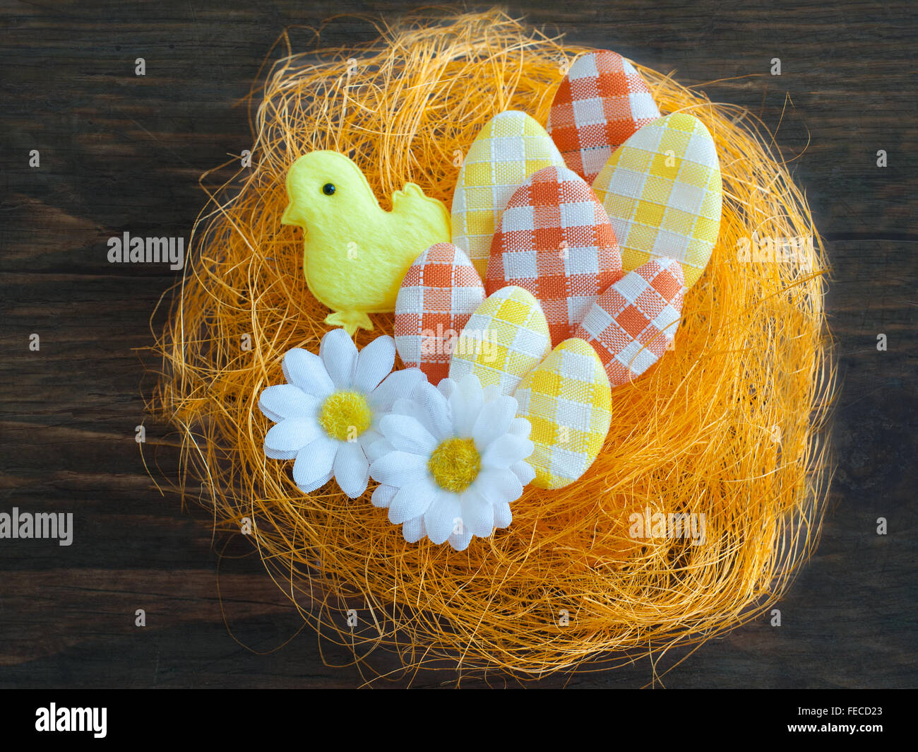Easter eggs in an artificial nest Stock Photo