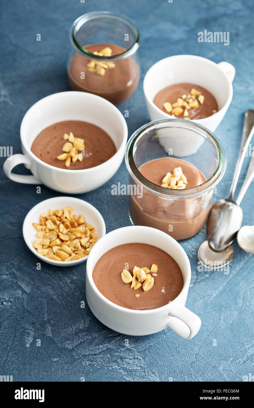 Chocolate yogurt dessert with salted peanuts in cups Stock Photo