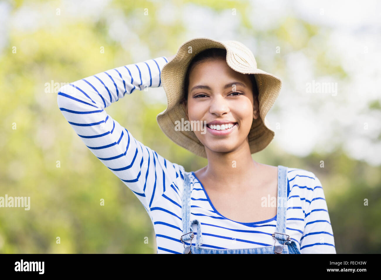 Holding straw hat on head hi-res stock photography and images - Alamy