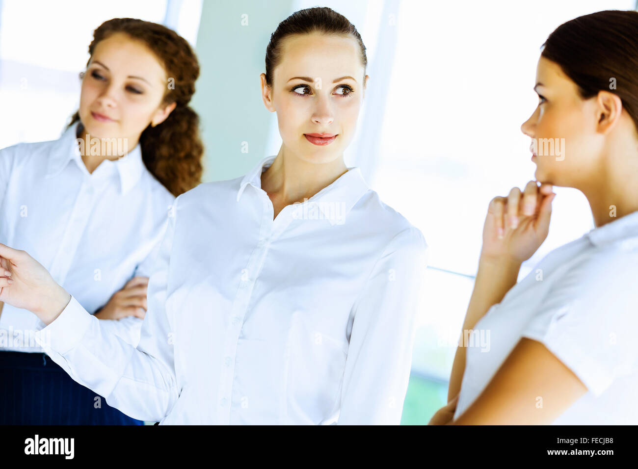 Image of three young businesswomen at meeting Stock Photo - Alamy