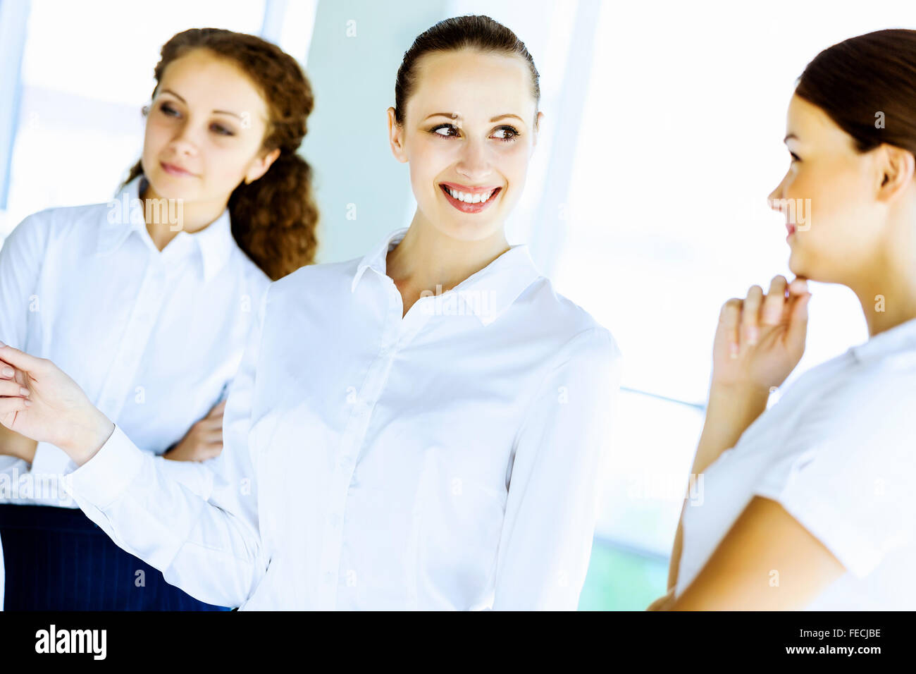 Image of three young businesswomen at meeting Stock Photo - Alamy