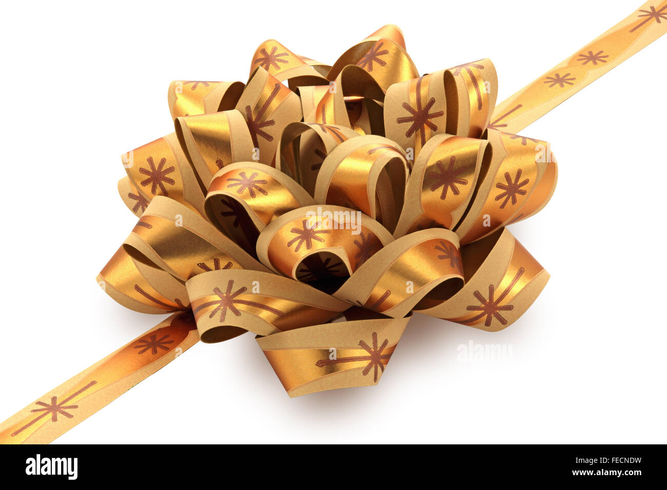 Golden gift bow with ribbon isolated on the white background, clipping path included. Stock Photo