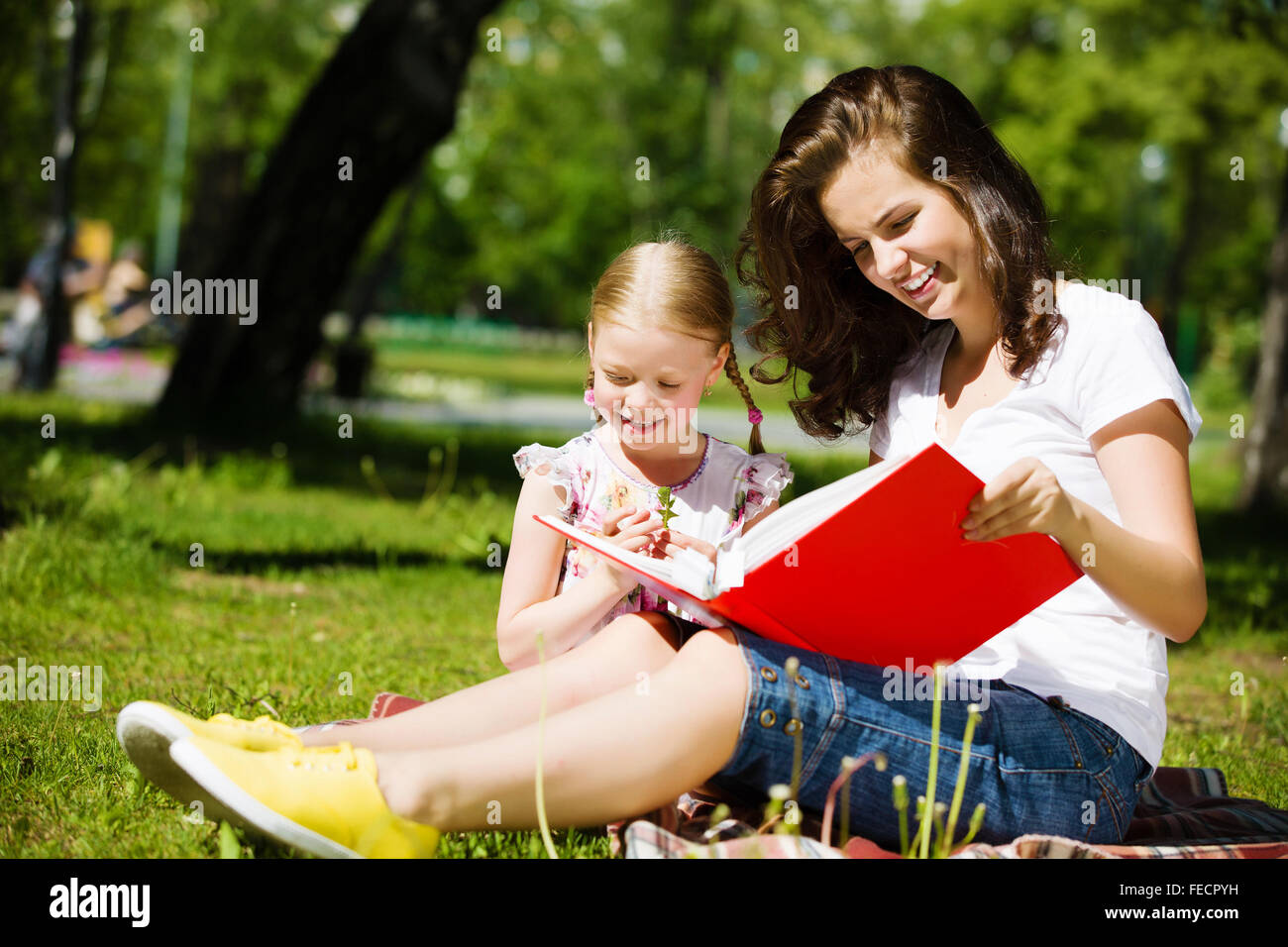 Image of cute girl and her mother playing in park Stock Photo - Alamy