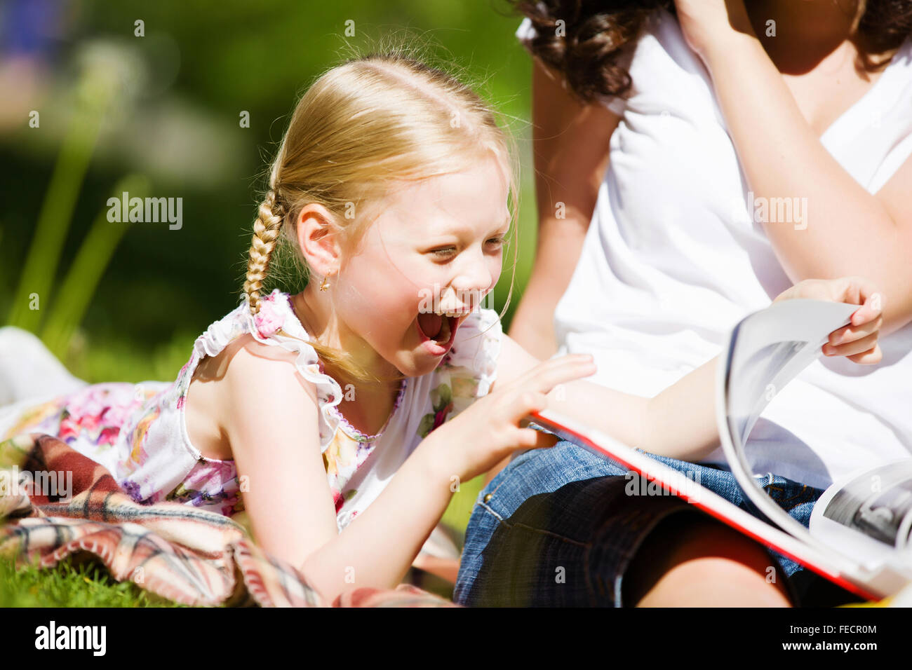 Image of cute girl and her mother playing in park Stock Photo - Alamy