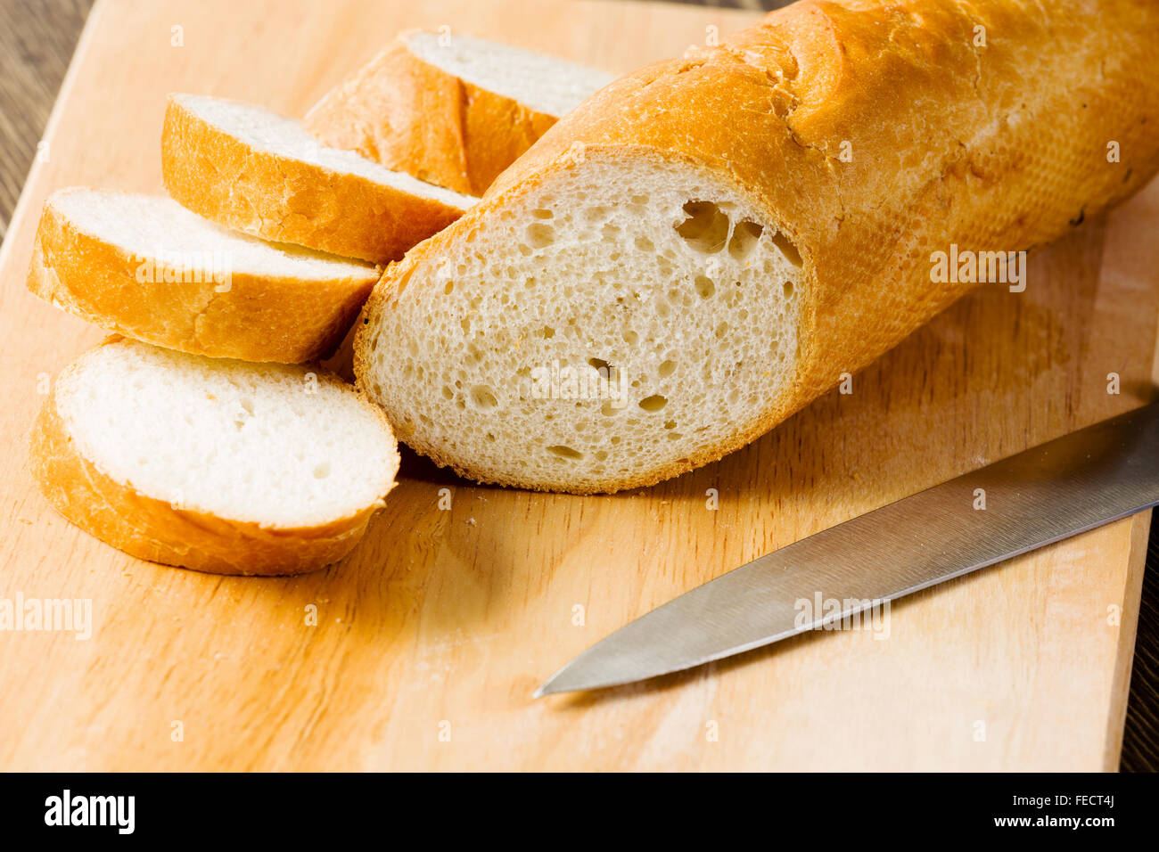 Fresh white sliced bread lying on table Stock Photo - Alamy