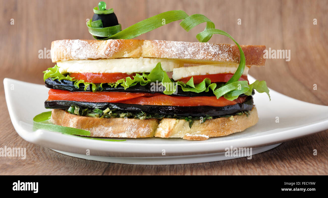 Sandwich with eggplant, tomatoes, peppers and cheese Stock Photo Alamy