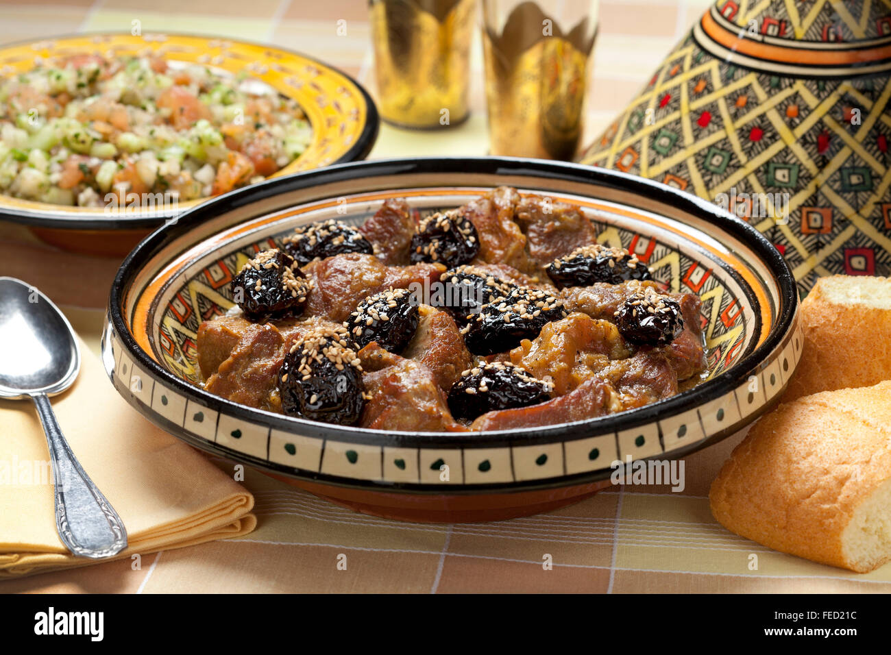 Traditional Moroccan dish with meat, plums and sesame seeds close up Stock Photo