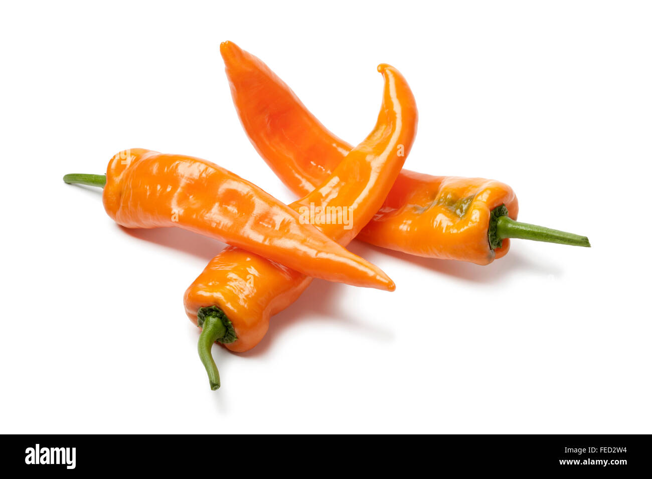 Fresh orange sweet peppers on white background Stock Photo