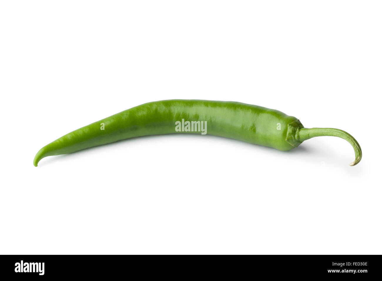 Fresh whole single green chili pepper on white background Stock Photo