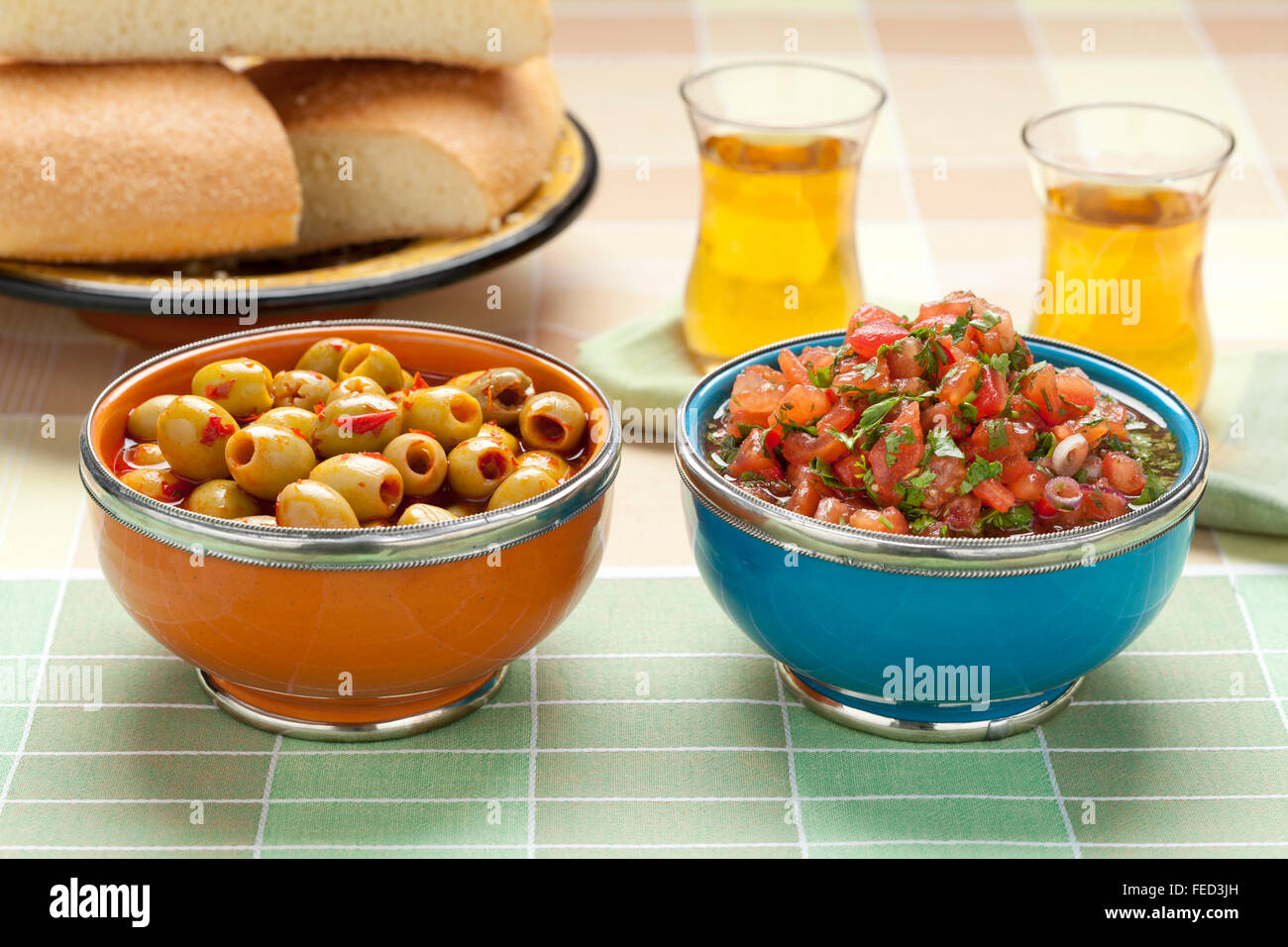 Moroccan snacks with salad, olives and tea Stock Photo