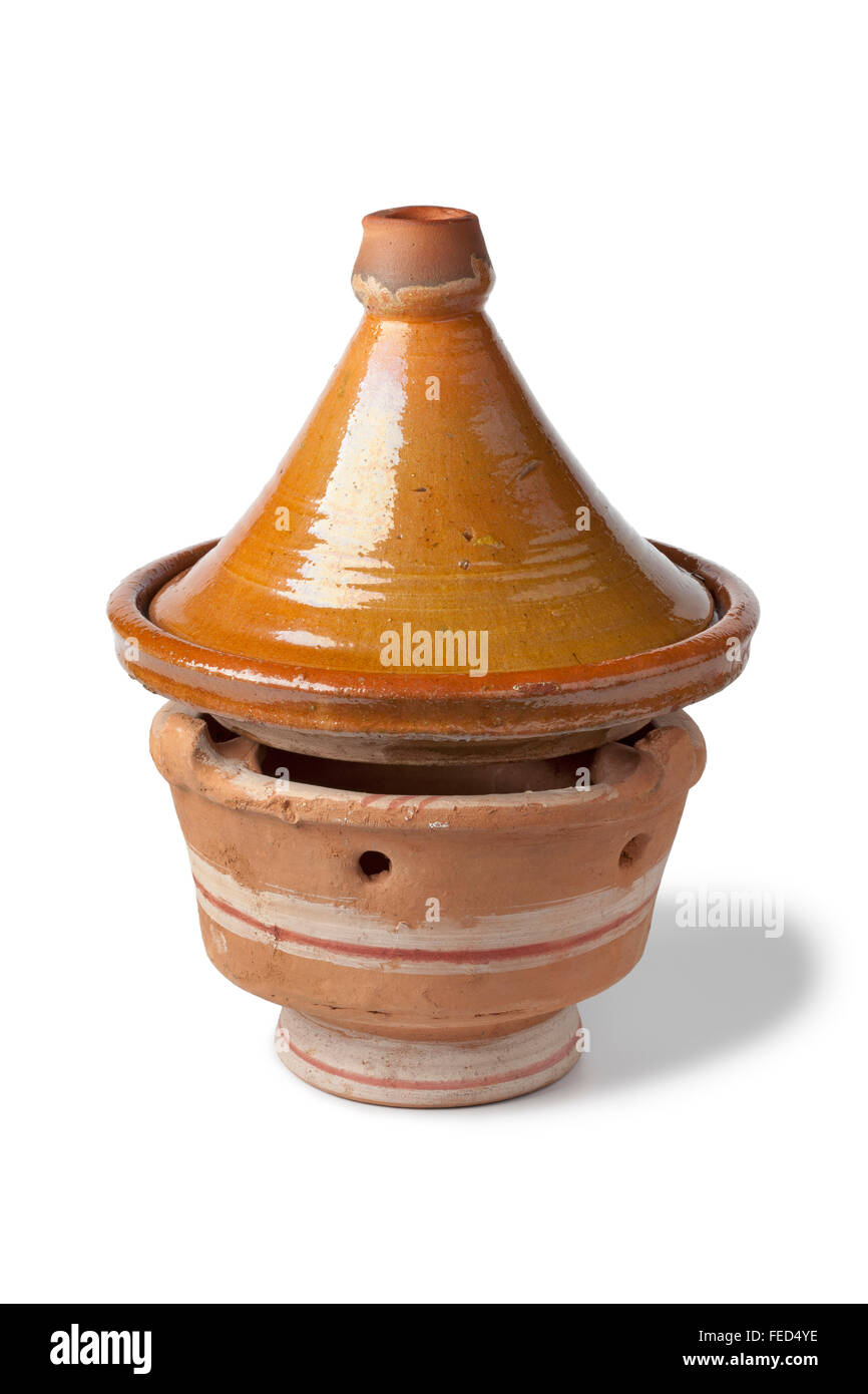 Simple traditional Moroccan tagine  at a charcoal stove on white background Stock Photo