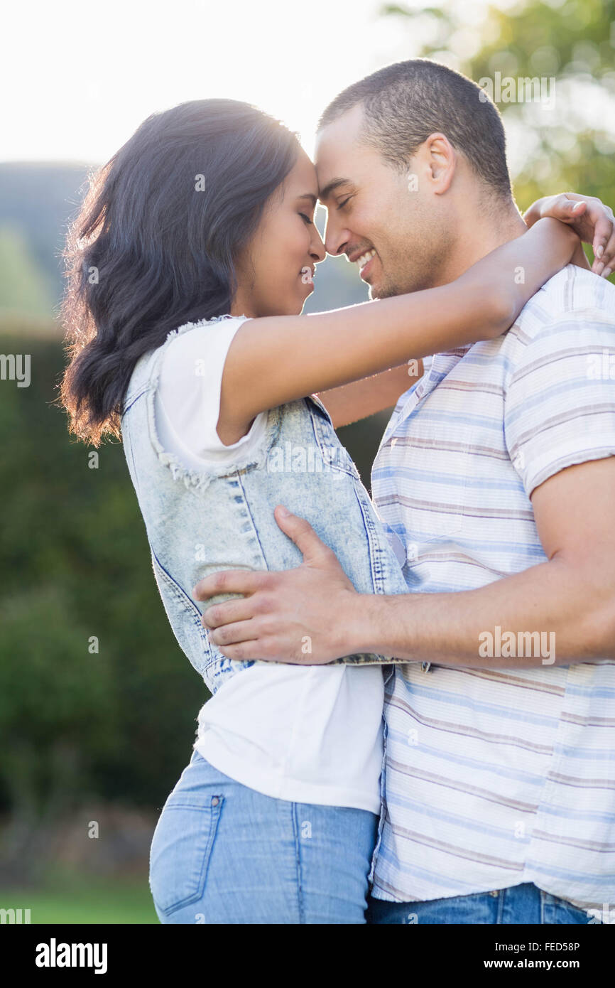 Happy lover couple hugging hi-res stock photography and images - Alamy