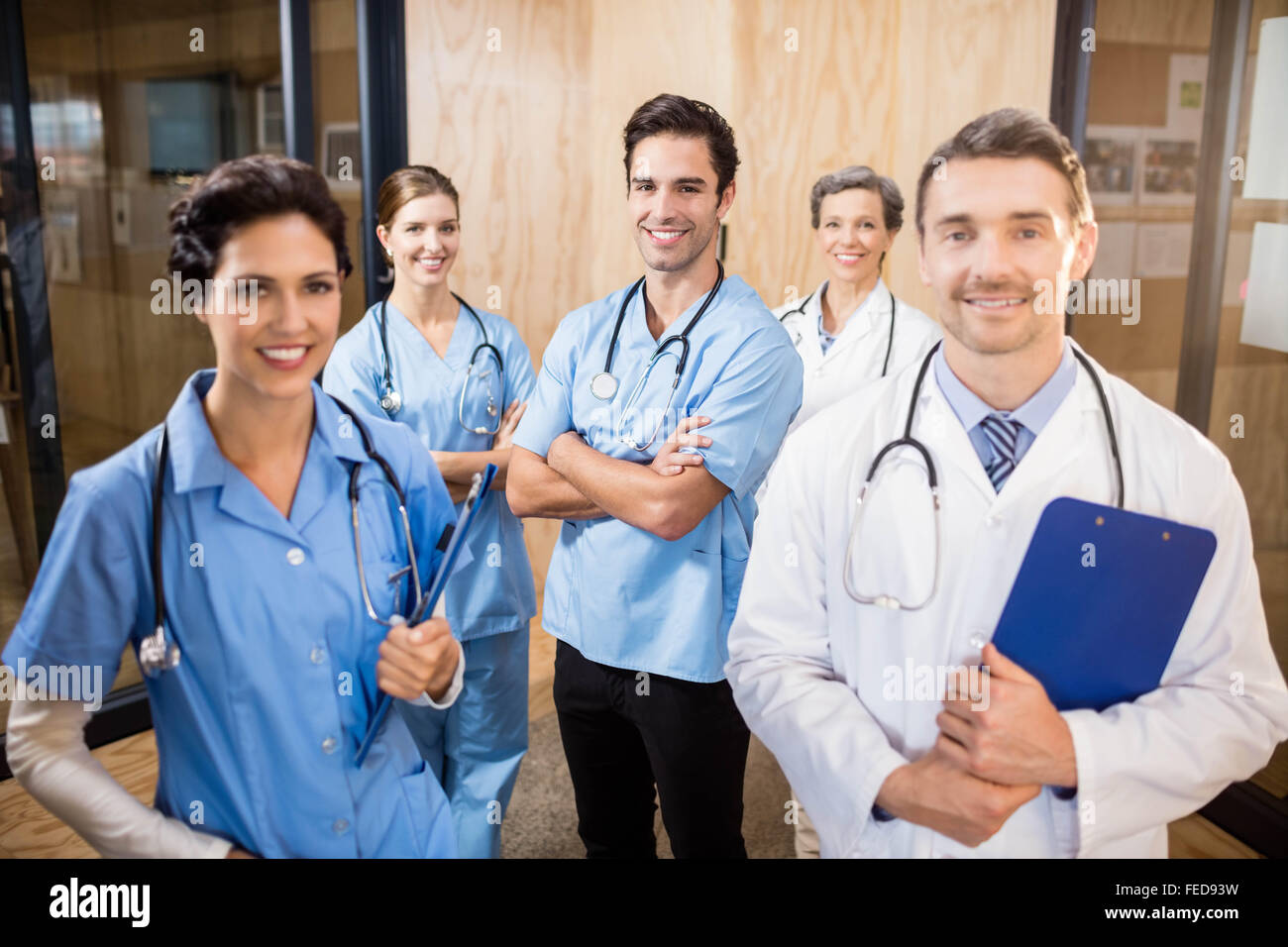 Medical team smiling at camera together Stock Photo - Alamy