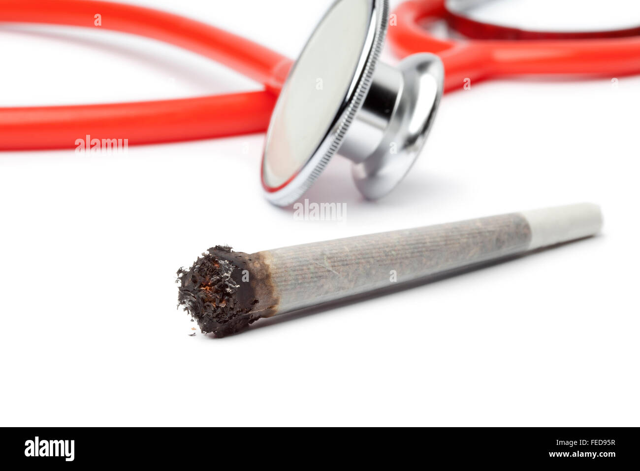 Lit reefer with stethoscope out of focus on background Stock Photo